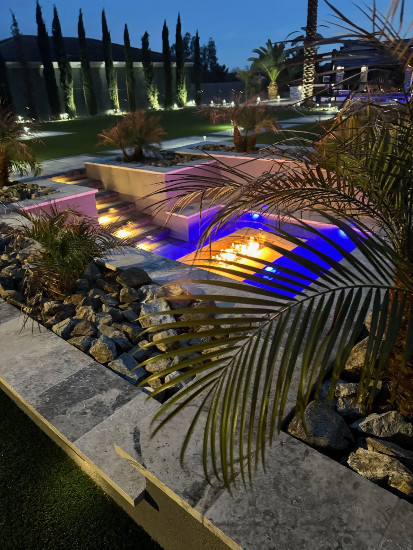 Aurora Estate — sunken fire pit with Italian cypress allée and color-changing landscape lighting